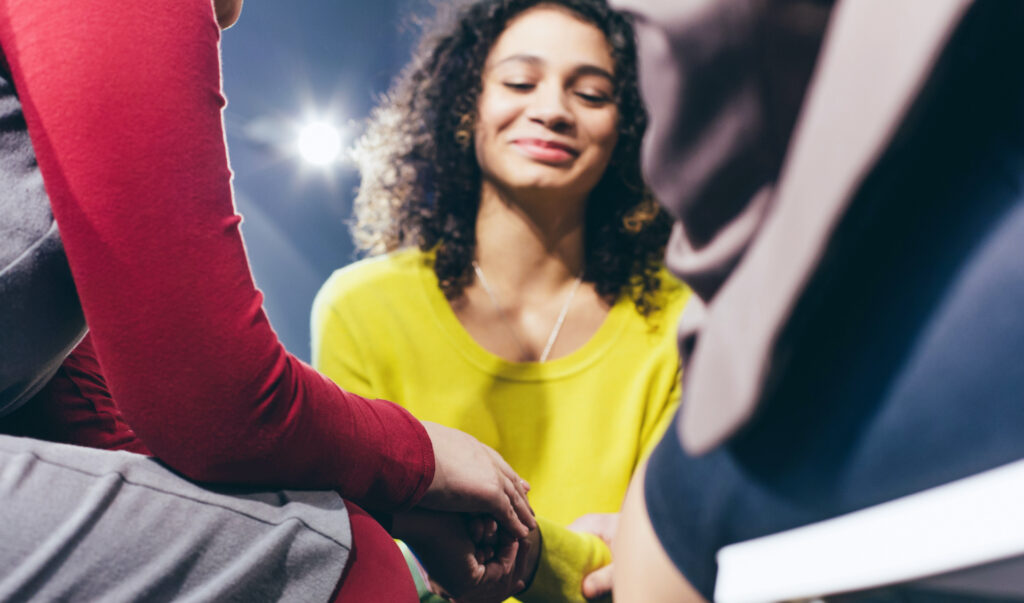 Woman healing in group therapy session