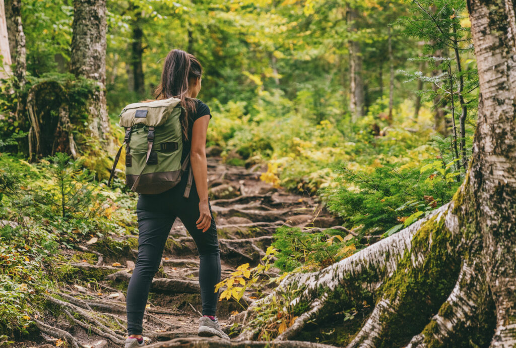 woman on trail walk maintaining health through movement