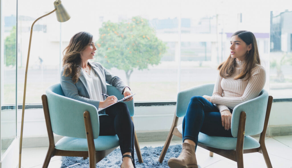 Young woman in therapy session discussing trust