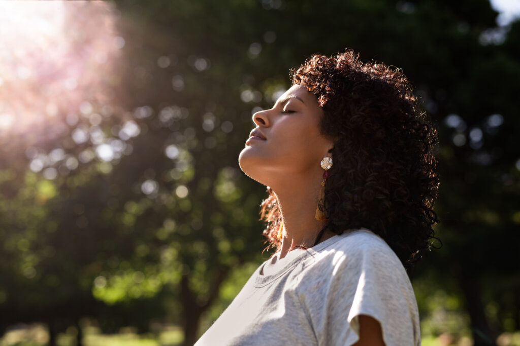 woman soaking in the sun during spring equinox