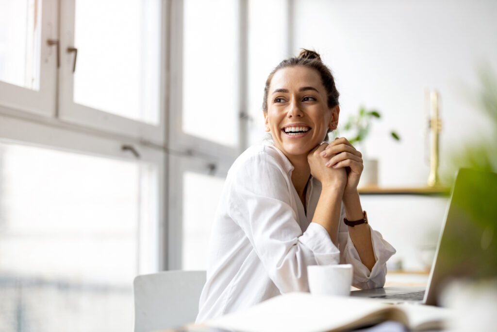 women smiling practicing cognitive reframing 