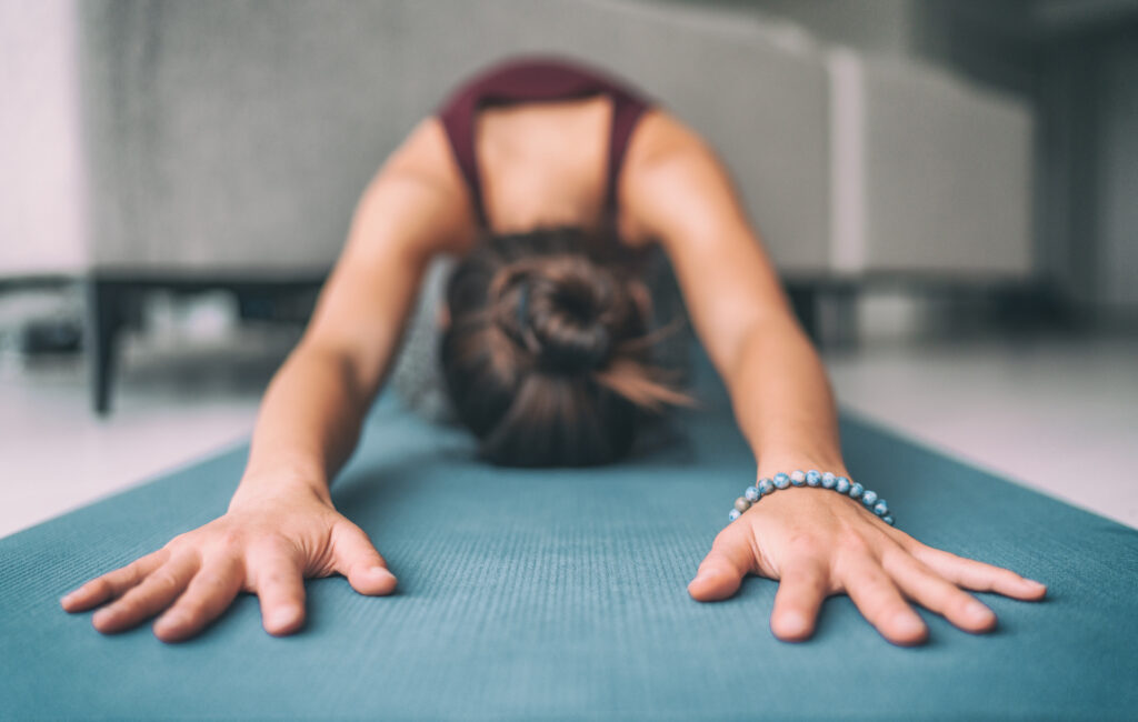 woman stretching to working through autumn anxiety