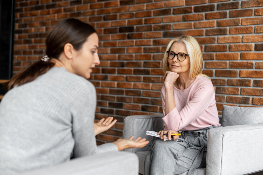 young woman speaking with therapist about autumn anxiety