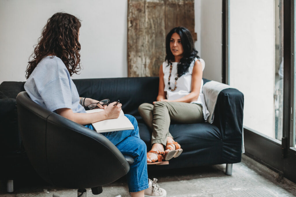 woman talking to therapist about stress