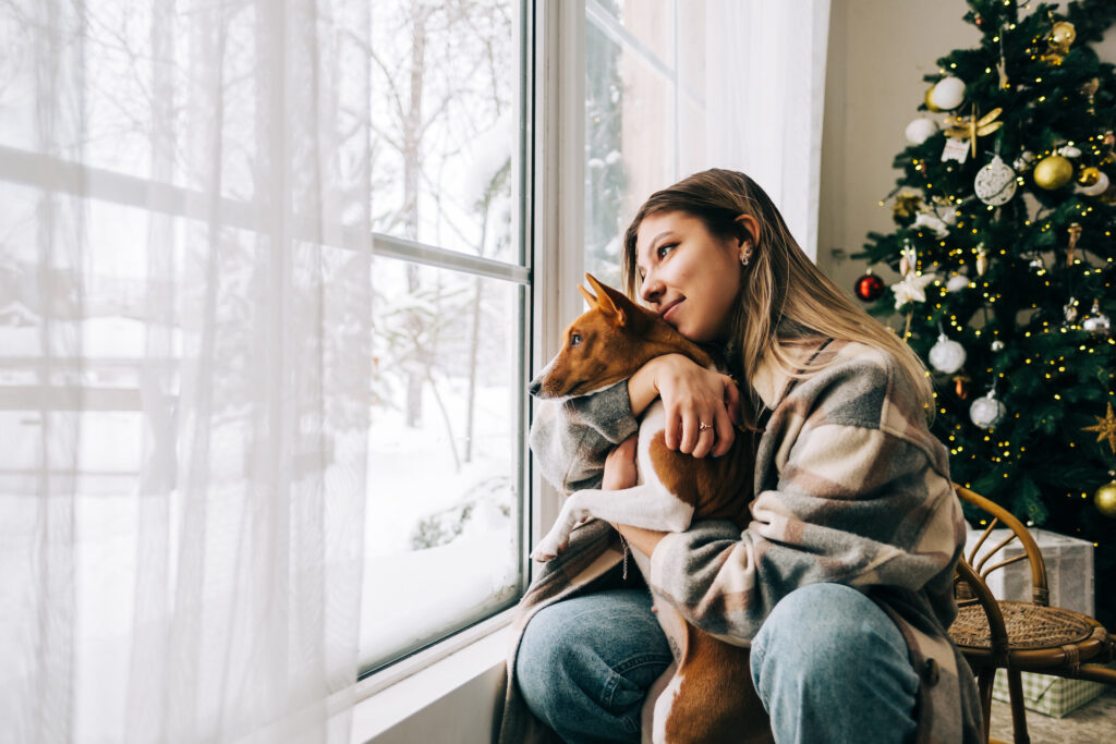 young woman with dog setting boundaries at christmas