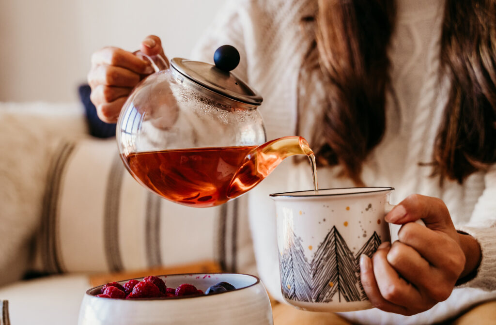 woman pouring tea