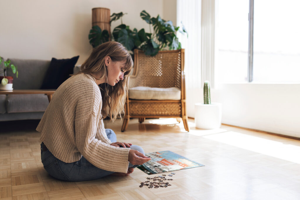 woman doing puzzle finding meaning in life