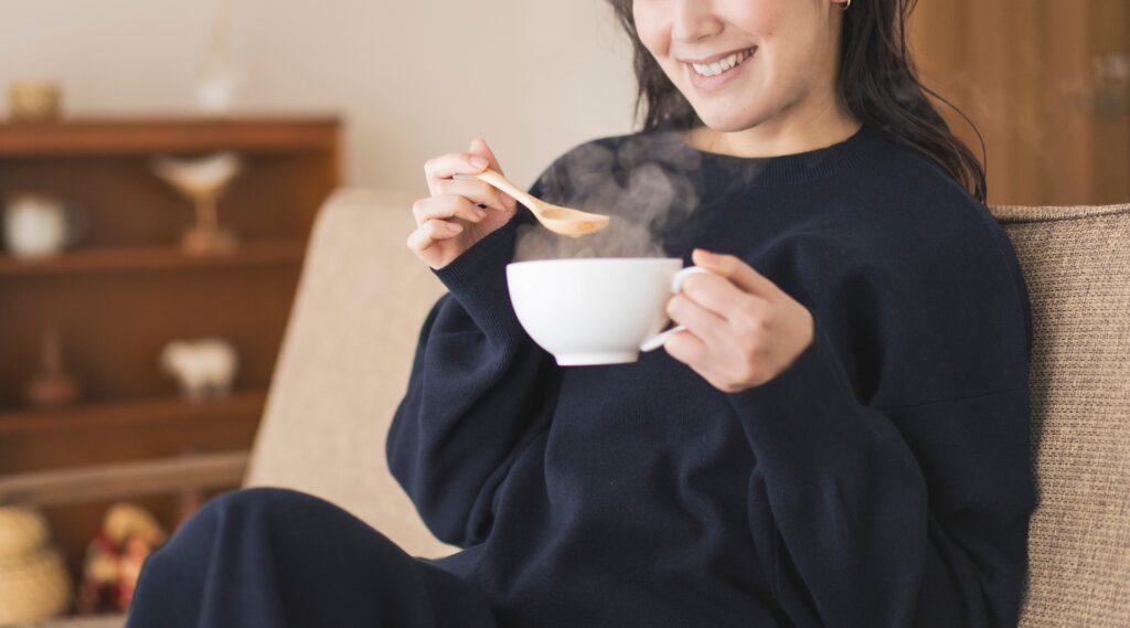 woman eating soup